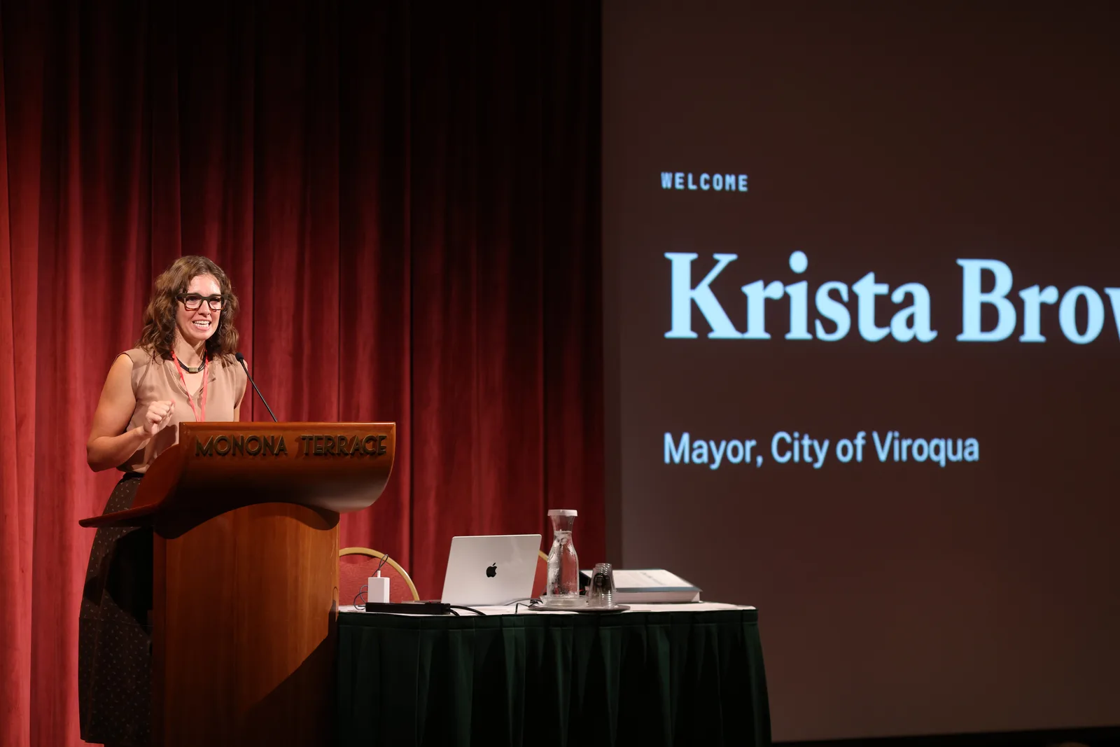 Photo 5 of 34. Viroqua Mayor Krista Browne speaks at the morning session at Monona Terrace.