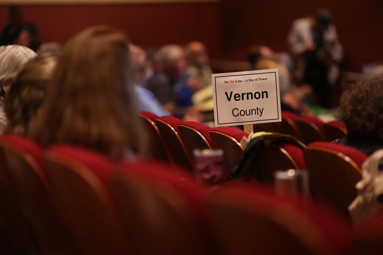 Photo 6 of 34. A Vernon County sign in the Lecture Hall seats.