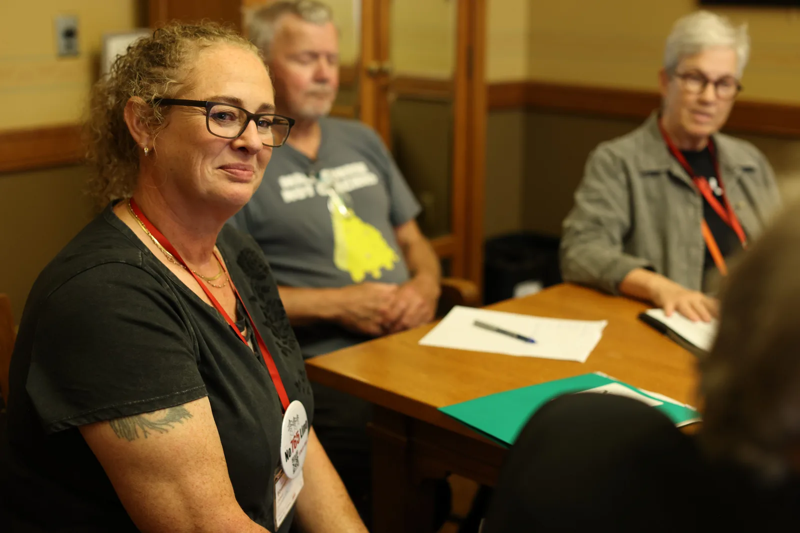 Photo 14 of 34. A resident smiles during an office meeting.