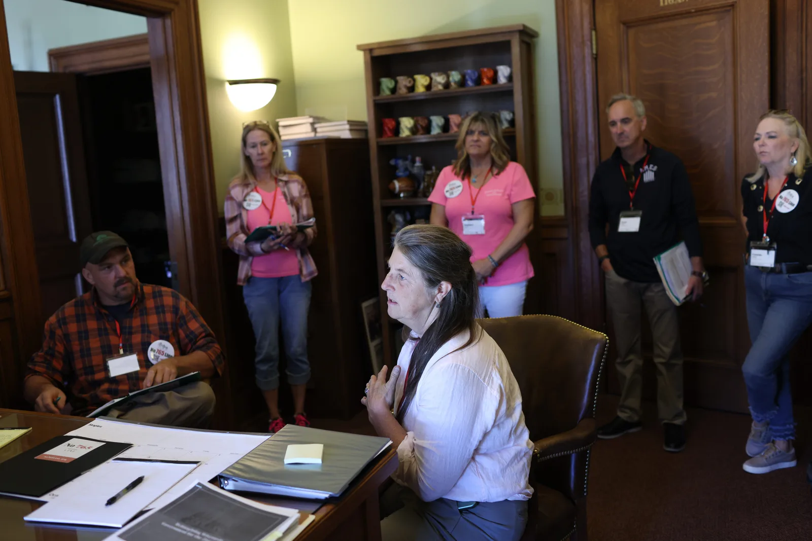 Photo 17 of 34. A team meets with staff in a legislator's office.