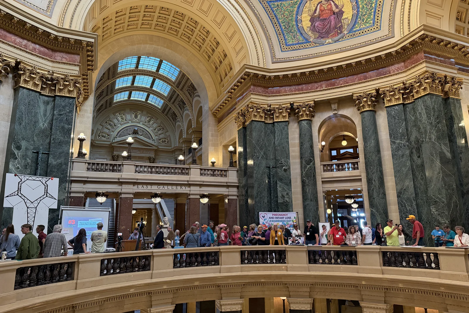 Photo 25 of 34. Residents line the Rotunda's upper railing beneath the dome.
